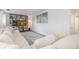 Bright living room showcasing a large sectional, built-in shelving and decorative wall art at 5831 W 108Th Pl, Westminster, CO 80020