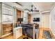 Bright living room features large windows, hardwood floors, exposed brick and modern furniture at 1376 N Pearl St # B1, Denver, CO 80203