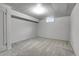 Bright basement area with neutral carpet, freshly painted walls, and window at 375 Kohl St, Broomfield, CO 80020