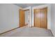 Bedroom featuring neutral carpet, standard closet and a window at 375 Kohl St, Broomfield, CO 80020