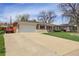 Charming single story house with mature trees and front yard, attached two car garage and paved driveway at 375 Kohl St, Broomfield, CO 80020