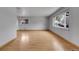 Open living room featuring hardwood floors, large windows, and neutral paint at 375 Kohl St, Broomfield, CO 80020