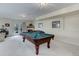 Finished basement features a pool table, fireplace, and ample space for entertaining at 4133 Niblick Dr, Longmont, CO 80503