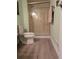 Bathroom with enclosed shower, toilet and vinyl flooring at 4133 Niblick Dr, Longmont, CO 80503