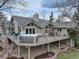 A spacious deck featuring a hot tub and outdoor seating at 4133 Niblick Dr, Longmont, CO 80503