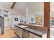 Kitchen featuring granite countertops, stainless steel dishwasher, and an open layout at 4133 Niblick Dr, Longmont, CO 80503