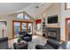 Inviting living room with a fireplace, tv, and access to the outdoors at 4133 Niblick Dr, Longmont, CO 80503