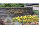 Stone entrance sign for Lake Valley Golf Club, surrounded by vibrant flowers and greenery at 4133 Niblick Dr, Longmont, CO 80503