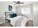 Bright bedroom with ceiling fan, modern art, and large window at 1581 Wolff St, Denver, CO 80204