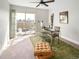 Bright bedroom with work space, rug, and sliding doors to a roof top deck at 1581 Wolff St, Denver, CO 80204