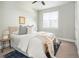 Comfortable bedroom with soft lighting, plush bedding, and a serene atmosphere at 1581 Wolff St, Denver, CO 80204