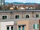 Close-up exterior view of townhomes with balconies, showcases the contemporary architectural style and neighborhood charm at 1581 Wolff St, Denver, CO 80204
