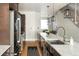 Sleek kitchen with stainless steel appliances and a spacious island at 1581 Wolff St, Denver, CO 80204