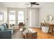 Cozy living room with hardwood floors and comfortable seating at 1581 Wolff St, Denver, CO 80204