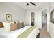 Cozy main bedroom with natural light, stylish decor, and an en-suite bathroom for added convenience at 1581 Wolff St, Denver, CO 80204