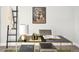 Stylish office space with modern desk, gold lamp, ladder, and neutral décor at 1581 Wolff St, Denver, CO 80204