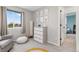 Neutral Bedroom features soft rug, comfortable glider and rainbow decor at 1540 Meachum Way, Erie, CO 80516