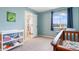 Cozy Bedroom features a peek into the en suite bathroom for convenience at 1540 Meachum Way, Erie, CO 80516