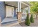 Inviting front porch with stone pillars, railing, and a 'Welcome' sign at 1540 Meachum Way, Erie, CO 80516