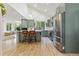 Modern kitchen with stainless steel appliances, quartz countertops, and barstool seating at 1540 Meachum Way, Erie, CO 80516