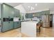 Stylish kitchen featuring a large island, stainless steel appliances, and modern cabinetry at 1540 Meachum Way, Erie, CO 80516
