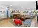 Bright living room features hardwood floors, fireplace and comfortable seating at 1540 Meachum Way, Erie, CO 80516