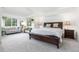 Bright main bedroom boasts neutral decor, vaulted ceilings, and a cozy sitting area at 1540 Meachum Way, Erie, CO 80516