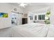 Bright main bedroom features vaulted ceilings, an ensuite bath, and a sitting area by the windows at 1540 Meachum Way, Erie, CO 80516