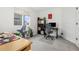 Bright office space features natural light, neutral carpet, contemporary decor, and dual desk setup at 1540 Meachum Way, Erie, CO 80516