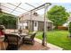 Inviting backyard with patio seating and a detached garage at 3317 Harlan St, Wheat Ridge, CO 80033