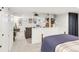 Open bedroom/living space with built-in shelving and a neutral color palette at 3317 Harlan St, Wheat Ridge, CO 80033