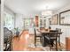 Bright dining area boasts stylish decor and plenty of natural light perfect for enjoying meals with Gathering and friends at 3317 Harlan St, Wheat Ridge, CO 80033