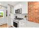 Modern kitchen featuring stainless steel appliances and white subway tile backsplash at 3317 Harlan St, Wheat Ridge, CO 80033