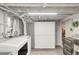 Finished laundry room with front loading washer and dryer and folding table at 3317 Harlan St, Wheat Ridge, CO 80033