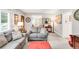 Inviting living room with stylish furnishings, including cozy sofas, a decorative lamp and a warm and welcoming atmosphere at 3317 Harlan St, Wheat Ridge, CO 80033