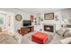 Bright living room featuring modern decor, comfortable seating, and a decorative fireplace adding warmth to the space at 3317 Harlan St, Wheat Ridge, CO 80033