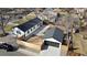 Aerial view of the home, detached garage, driveway, backyard and wooden fence at 2990 S Elm St, Denver, CO 80222