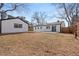 Exterior view of the home with a detached garage and concrete patio in the backyard at 2990 S Elm St, Denver, CO 80222