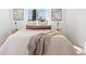 Comfortable bedroom with stylish decor, neutral tones, and natural light at 2990 S Elm St, Denver, CO 80222