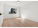 Bright bedroom features a window providing natural light and beautiful flooring at 2990 S Elm St, Denver, CO 80222