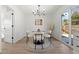 Chic dining area featuring modern furniture and a sliding glass door providing ample natural light at 2990 S Elm St, Denver, CO 80222