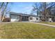 View of home showcasing a green lawn, walkway, and inviting facade with new paint at 2990 S Elm St, Denver, CO 80222