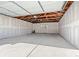 Spacious garage interior with a concrete floor and an overhead door at 2990 S Elm St, Denver, CO 80222