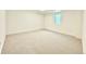 Comfortable bedroom in basement featuring neutral carpet and a bright window at 1559 S Forest St, Denver, CO 80222