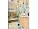 Walk-in shower with wood accent wall and glass door, plus double vanity at 1559 S Forest St, Denver, CO 80222