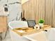 Close-up shot of the elegant soaking tub including the decorative bath tray at 1559 S Forest St, Denver, CO 80222