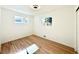 Bright bedroom featuring hardwood floors and natural light at 1559 S Forest St, Denver, CO 80222