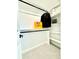 Well-organized closet featuring shelving and black closet rods at 1559 S Forest St, Denver, CO 80222