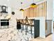 Charming kitchen features a marble floor, a breakfast bar, and modern appliances at 1559 S Forest St, Denver, CO 80222