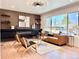 Cozy living room features modern furnishings, decorative fireplace, and a large window with natural light at 1559 S Forest St, Denver, CO 80222